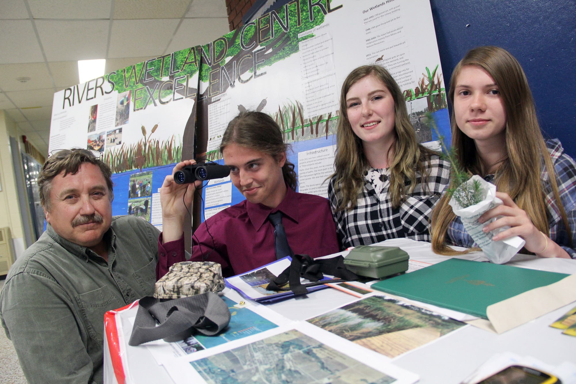 Students in the wetlands management class at Rivers Collegiate, from left, Jesse Silvius, Emma Gray and Eliese Schwennesen, have helped develop the wetlands on the east end of their community. The class, joined by teacher Daniel Kiazyk, left, was a big part of their school receiving a national award for the importance they place in environmental education. (Ian Froese/The Brandon Sun)