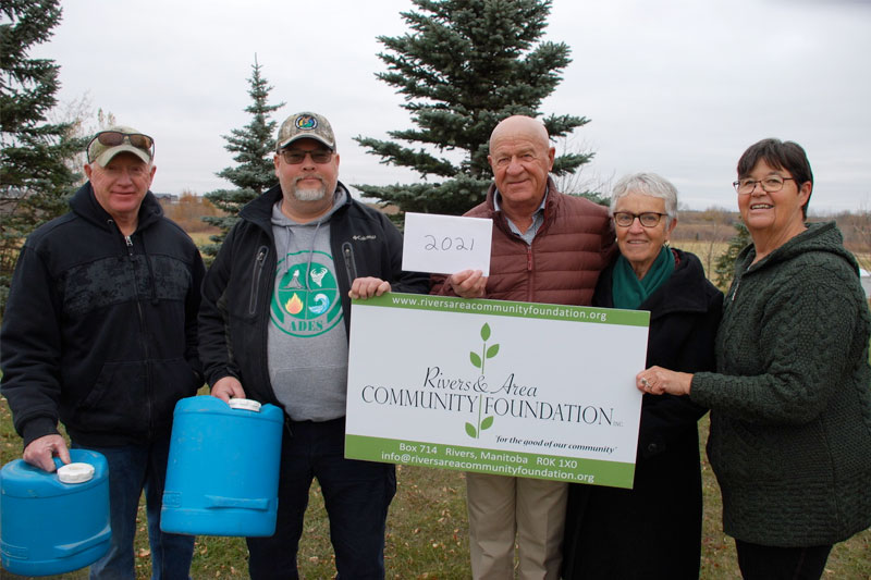 Association Treasurer Kelvin Lamb, Gun Range committee chair Bob Futrell received their grant from Jim Madder and Mavis White representing the Sibbald family and RACF Director Donna Falkevitch who represented both RACF and the Sibbald family.